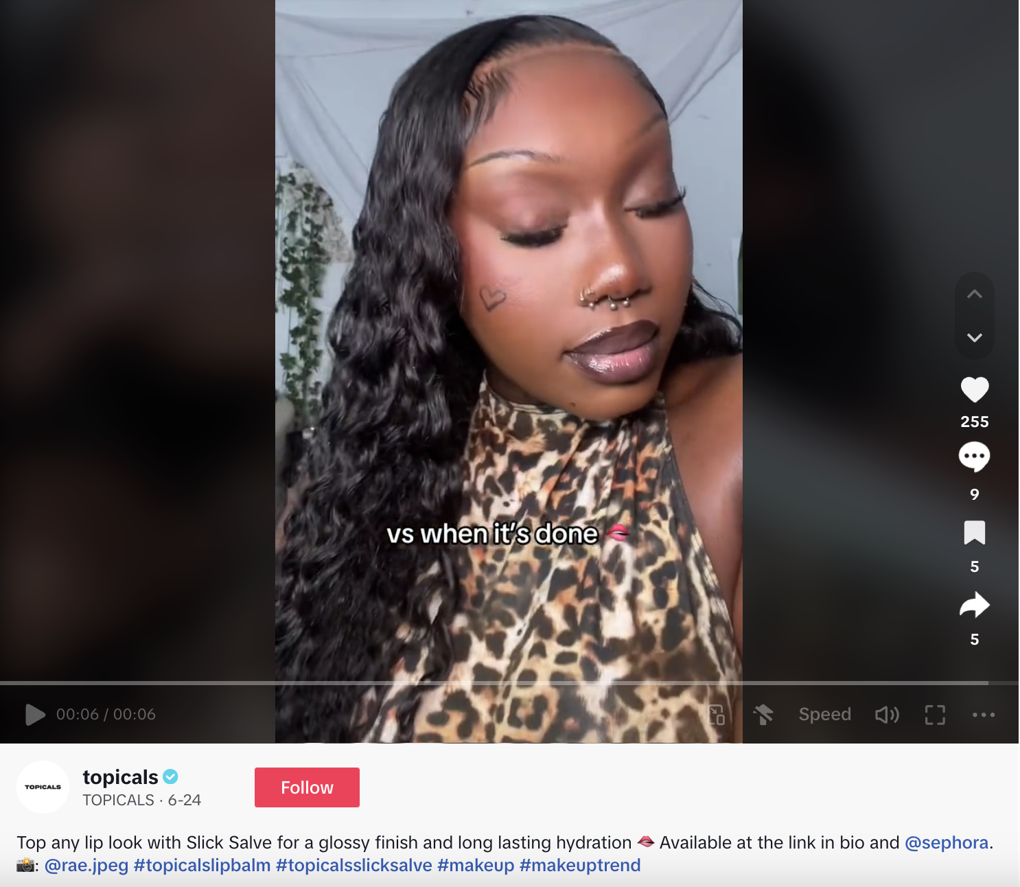 A TikTok video of an influencer applying the Topicals Slick Salve lip product