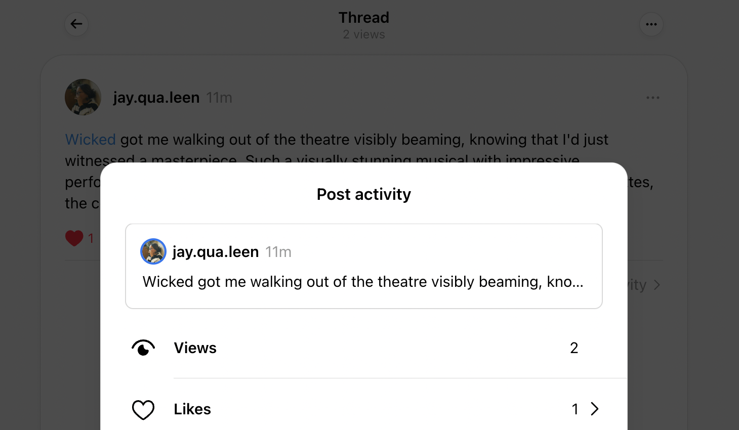 pop-up window displaying post activity on Threads with view and like counts