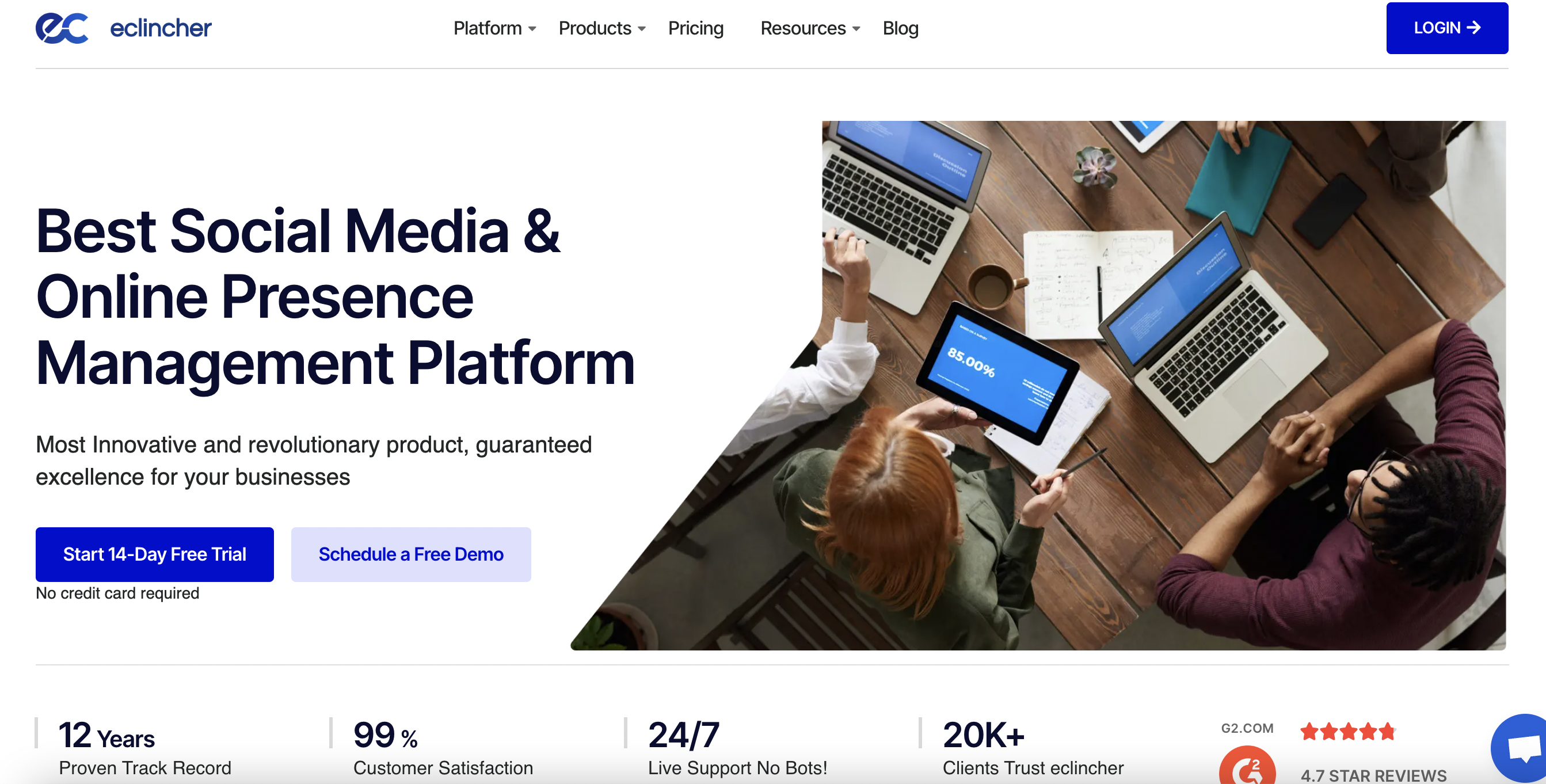 eClincher homepage with an aerial view of a team working together on a desk with laptops and tablets and text that reads 
