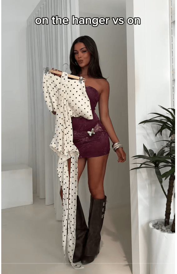 Princess Polly TikTok post of a young woman holding clothes with text overlay that reads “on the hanger vs on